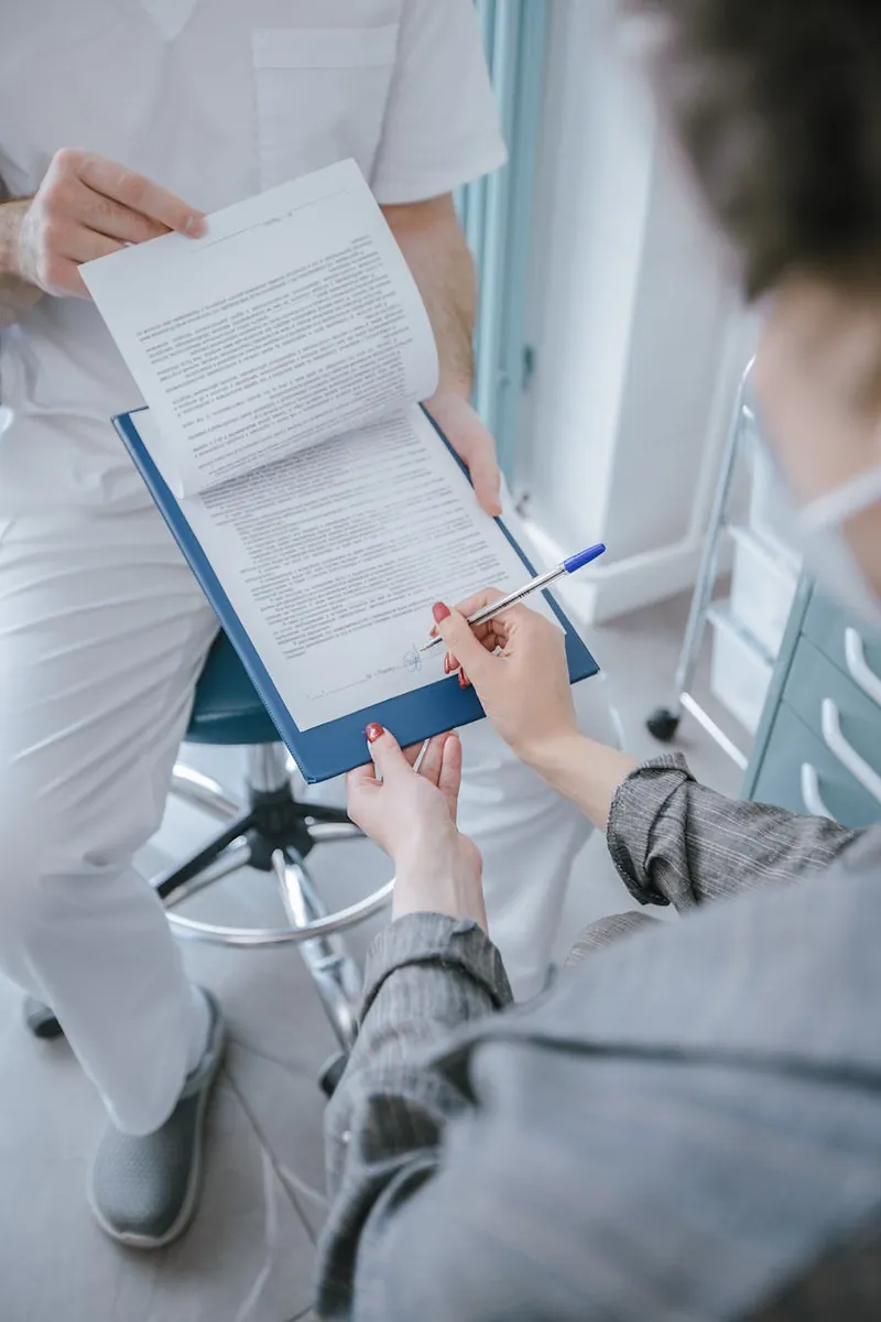 Patient completing registration paperwork